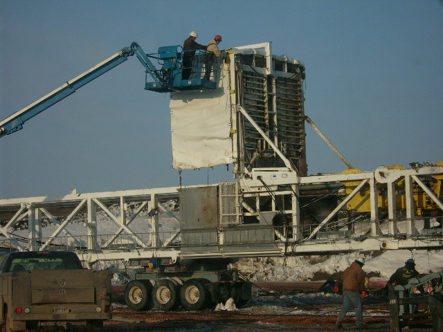 Installing tarp on a oil rig