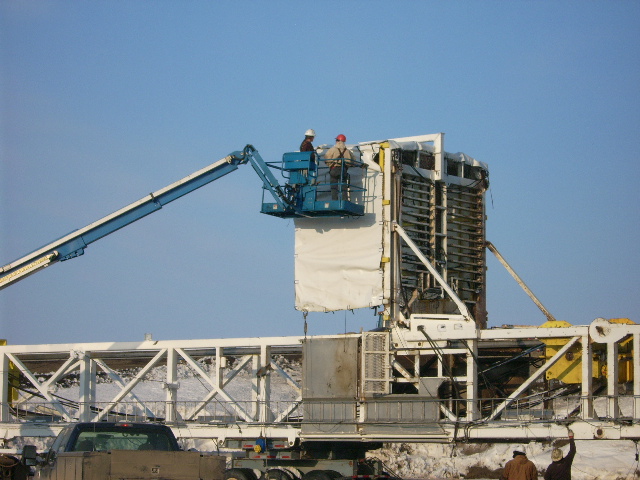 Installing tarp on a oil rig